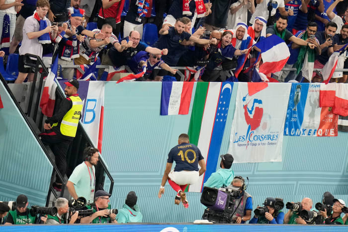 Kylian Mbappe races to celebrate with France fans